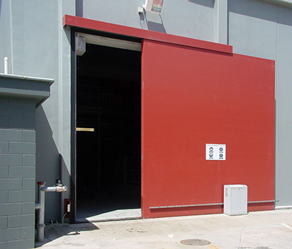 Industrial sliding doors for extremely heavy use